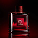 Flacon Habit Rouge Rouge Privé de Guerlain, vue de face sur fond neutre.
